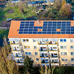 View of a block of flats with solar panels on form teh air