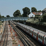 Train on a track heading towards a bridge