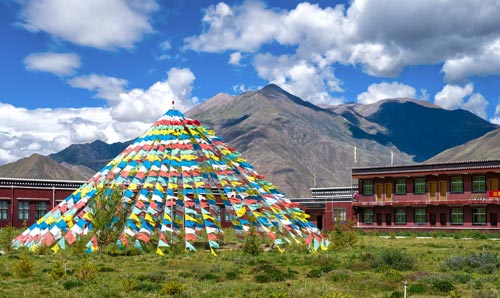 Village in Tibet with colourful flags